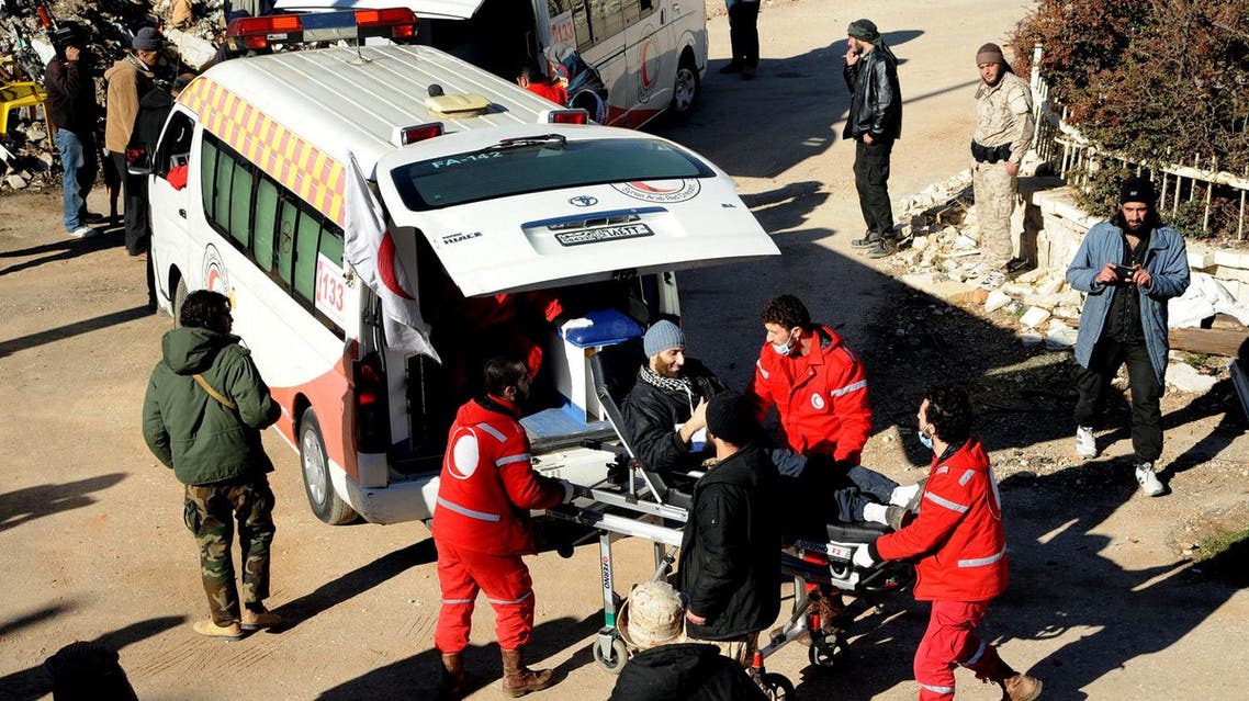 In this file photo released on December 28, 2015, by the Syrian official news agency SANA, Syrian Red Crescent workers carry a wounded Syrian opposition fighter, during an evacuation from the town of Zabadani, in Syria. A young man has died of malnutrition and a surgeon killed by a sniper in two besieged towns in western Syria this past month in a stark reminder that sieges continue to kill Syrians despite international efforts to defuse them in halting negotiations in Europe. (SANA via AP, File)