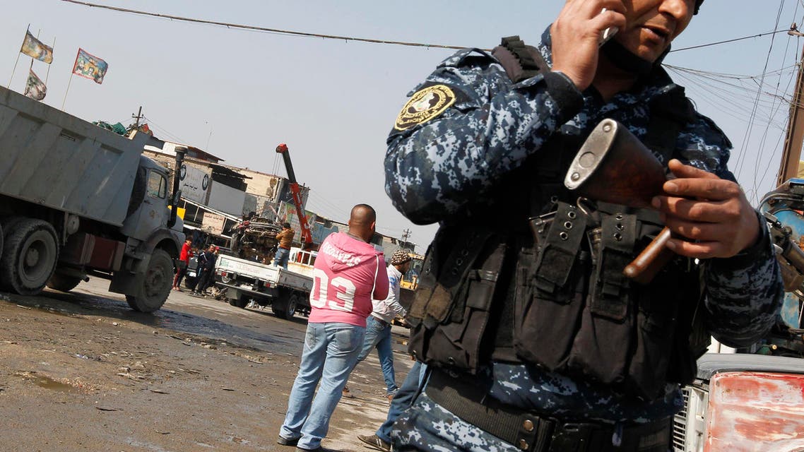 Iraqi police check the site where a car bomb exploded in an industrial area of south Baghdad on February 14, 2017 killing at least four people. (AFP)