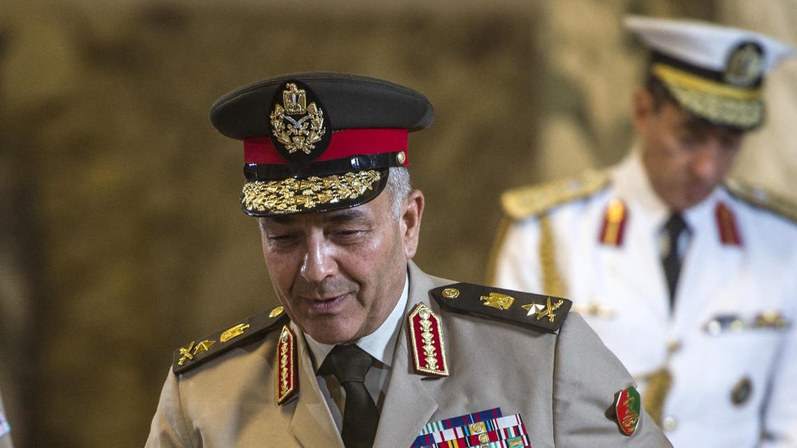 Egyptian army's chief of staff Mahmoud Hegazy (C) arrives for a ceremony to sign military contracts at the presidential palace on October 10, 2015 in the Egyptian capital Cairo. Egypt signed a contract to buy two Mistral warships whose sale to Russia Paris cancelled because of the Ukraine crisis, a delegation member with the visiting French prime minister said. AFP PHOTO / KHALED DESOUKI