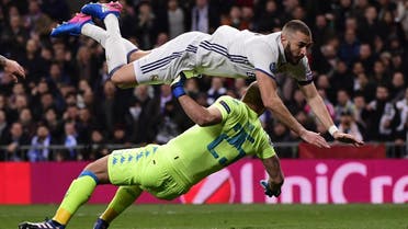 Karim Benzema dives over Napoli’s goalkeeper during the UEFA Champions League match in Madrid on February 15, 2017. (AFP)