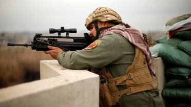 A member of Iraqi rapid response forces fires during a battle with Islamic State militants at Tigirs river frontline between east and west of Mosul , Iraq, January 25, 2017