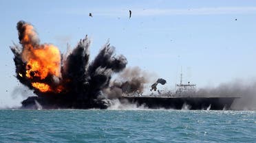 Iran's elite Revolutionary Guard troops attacks a naval vessel during a military drill in the Strait of Hormuz in southern Iran on February 25, 2015. (AFP)