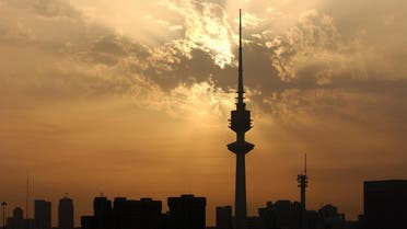 The sun sets over the Kuwait City skyline (File Photo: AFP/Romeo GACAD)