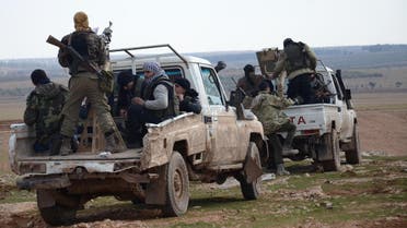 Fighters from the Free Syrian Army ride armoured pick up trucks during battles against Islamic State (IS) group jihadists near the town of Qabasin, located northeast of the city of Al-Bab, some 30 kilometres from Aleppo, on January 8, 2017.  Nazeer al-Khatib / AFP