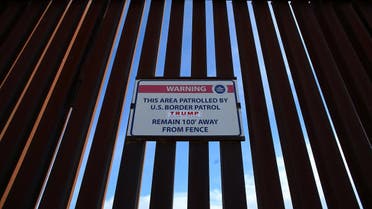 A Donald Trump for President campaign sticker is shown attached to a U.S. Customs sign hanging on the border fence between Mexico and the United States near Calexico, California, U.S. February 8, 2017. Picture taken February 8, 2017. (Reuters)