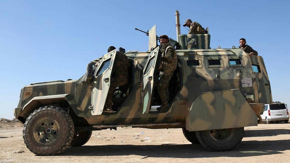 Syrian Democratic Forces (SDF) stand on their military vehicle in northern Deir al-Zor province ahead of an offensive against ISIS militants (Photo: Reuters/Rodi Said)