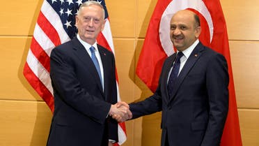 U.S. Defense Secretary Jim Mattis and Turkish Defence Minister Fikri Isik (R) pose during a NATO defence ministers meeting at the Alliance's headquarters in Brussels, Belgium February 15, 2017.