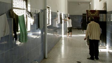 Suspected loyalists of killed Libyan leader Moamer Kadhafi gather outside their prison cells in Tripoli on November 20, 2011.