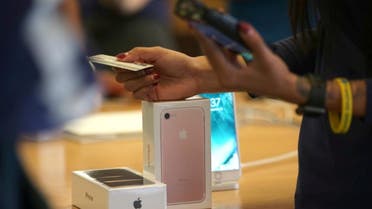 A customer buys the new iPhone 7 smartphone inside an Apple Inc. store in Los Angeles, California, U.S. on September 16, 2016. REUTERS