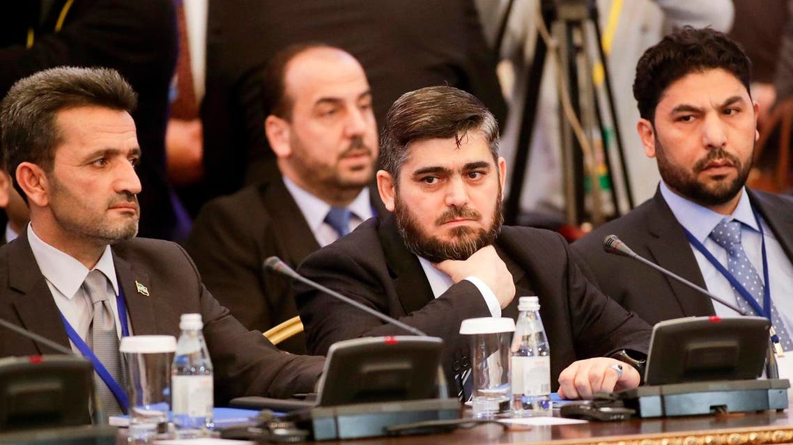 Mohammed Alloush, center, head of a Syrian opposition delegation, and other members attend talks on Syrian peace in Astana, Kazakhstan, Monday, Jan. 23, 2017. The talks are the latest attempt to forge a political settlement to end a war that has by most estimates killed more than 400,000 people since March 2011 and displaced more than half the country's population. (AP