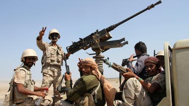 Yemeni government forces flash the sign for victory in the back of a heavily armed vehicle on the road leading to the southwestern port of Mokha after they recaptured the town from Shiite Huthi rebels on January 23, 2017. (AFP)