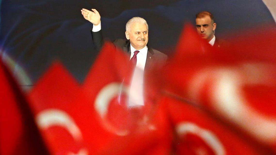 Turkish Prime Minister Binali Yildirim (L) waves after delivering a speech during an event in Oberhausen, western Germany. (AFP)