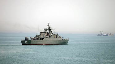 File photo of Iranian warship Alborz, foreground, as it leaves Iran's waters, at the Strait of Hormuz. (AP)