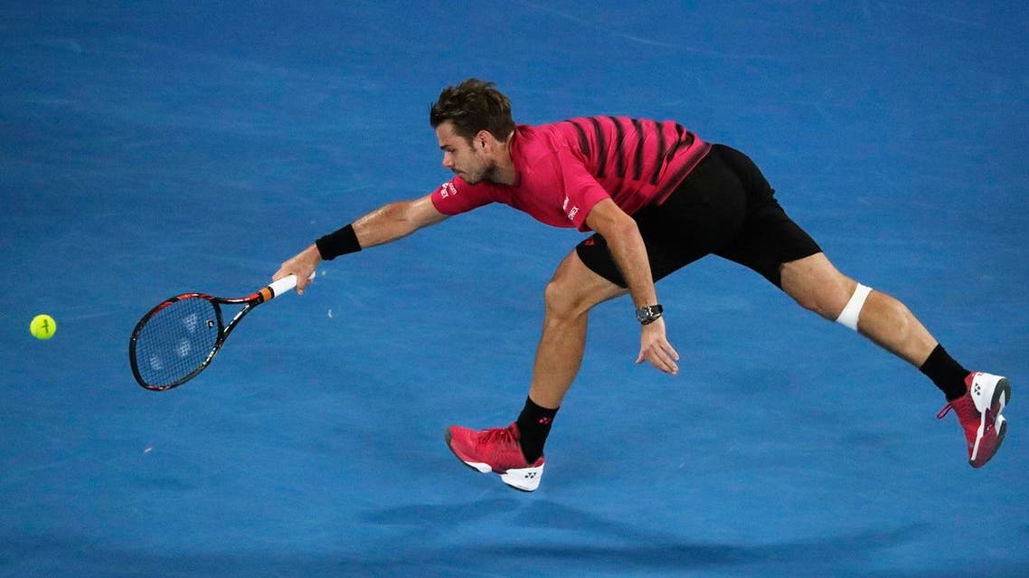 Switzerland's Stan Wawrinka stretches for a shot during his Men's singles semi-final match against Switzerland's Roger Federer. REUTERS