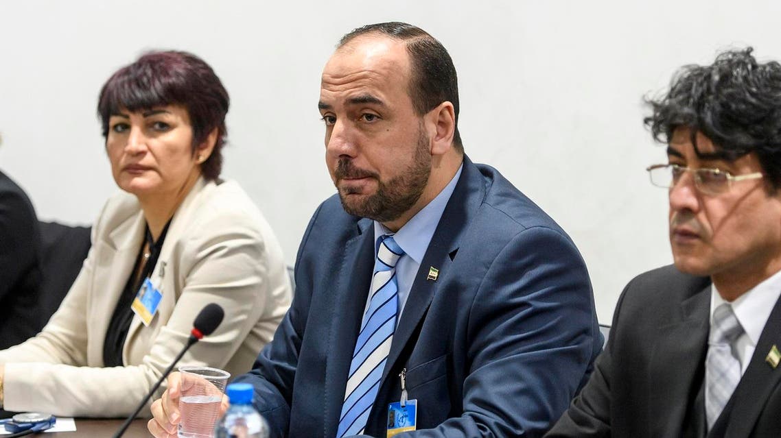 Syria's main opposition High Negotiations Committee (HNC) leader Nasr al-Hariri (C) poses ahead of a meeting of Intra Syria peace talks with UN Special Envoy for Syria Staffan de Mistura at the European headquarters of the United Nations in Geneva, on March 01, 2017. AFP