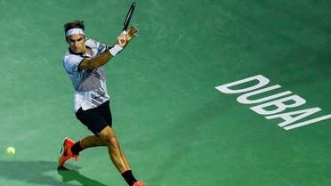 Roger Federer of Switzerland returns the ball to Russia's Evgeny Donskoy during their ATP tennis match as part of the Dubai Duty Free Championships on March 1, 2017, in Dubai.  STRINGER / AFP