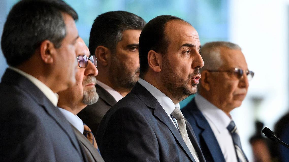 Syria's main opposition High Negotiations Committee (HNC) leader Nasr al-Hariri (2nd R) speaks to reporters after a meeting with UN Special Envoy during Syria peace talks on February 27, 2017 in Geneva. (AFP)