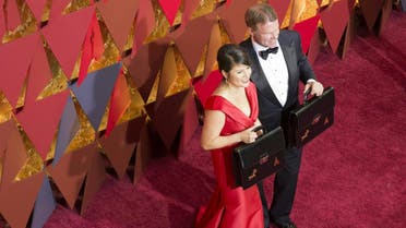 This file photo taken on February 26, 2017 shows Price Waterhouse and Coopers representatives Martha L. Ruiz (L) and Brian Cullinan (R) attending the 89th Annual Academy Awards in Hollywood, California. (AFP)