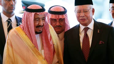Saudi Arabia's King Salman, left, stands next to Malaysian Prime Minister Najib Razak after inspecting an honor guard during a welcoming ceremony at Parliament House in Kuala Lumpur, Malaysia Sunday, Feb. 26, 2017. AP