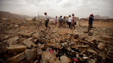 Tribesmen stand on the rubble of a building destroyed by a U.S. drone air strike, that targeted suspected al Qaeda militants in Azan of the southeastern Yemeni province of Shabwa February 3, 2013. Reuters