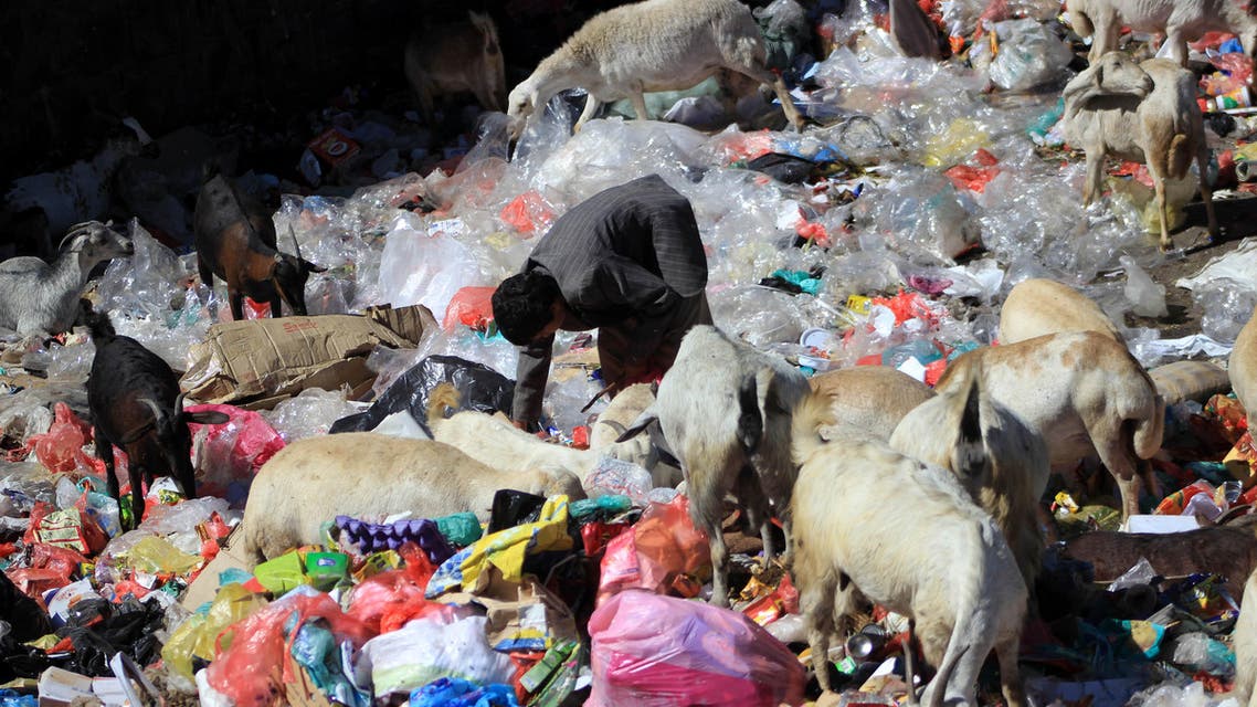 A Yemeni child collects items from the rubbish in the capital Sanaa on November 20, 2016 on the UN Universal Children's Day. AFP