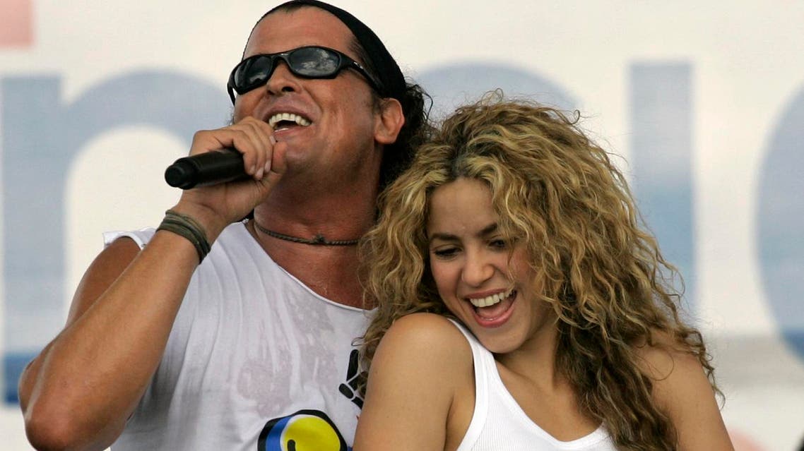 In this July 20, 2008 file photo, Colombian singers Shakira, right, and Carlos Vives perform during a "concert for peace" Independence Day celebrations in Leticia, Colombia. (AP)