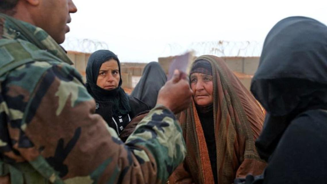 Syrian refugees from the informal Rukban camp, which lies in no-man's-land off the border between Syria and Jordan. (AFP)