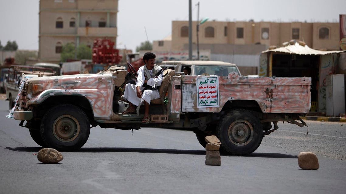 A militant from the Houthi Shiite militia group keeps guard in a patrol vehicle securing a street during a tribal gathering in the northwestern Yemeni city of Saada. (File photo: Reuters)