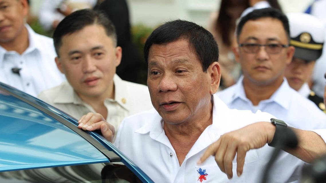 Philippine President Rodrigo Duterte (C) speaking to reporters (File Photo: Ace Morandante/PPD/AFP)