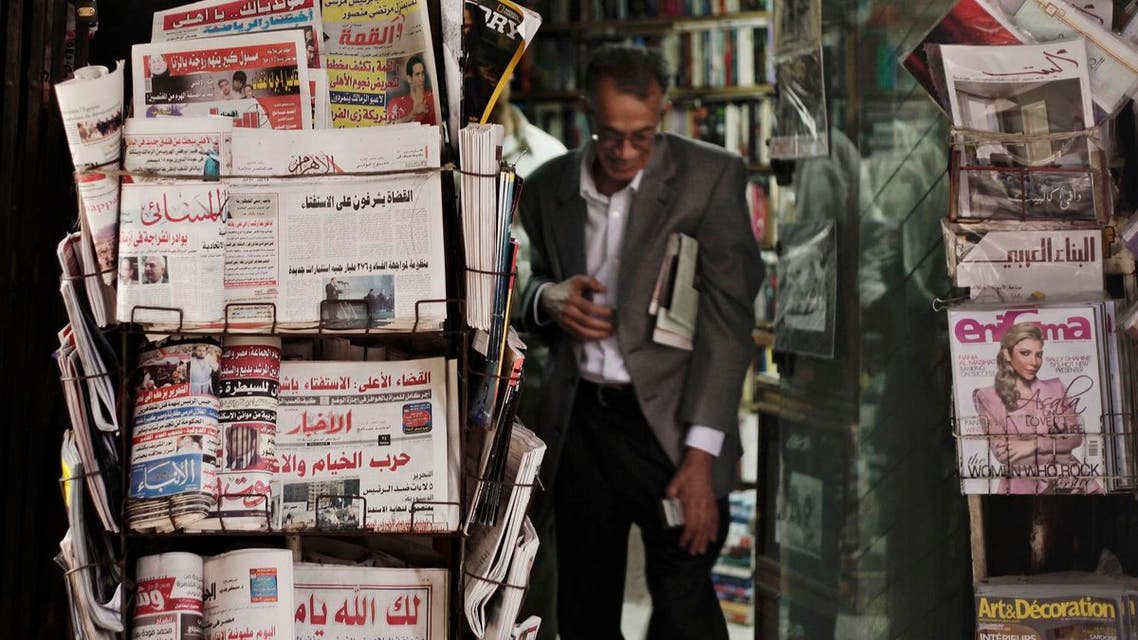An Egyptian walks past a stand displaying state-owned newspapers in Cairo, Egypt, Dec. 4, 2012. (File photo: AP)
