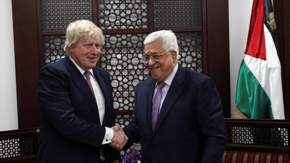 Britain's Foreign Secretary Boris Johnson shakes hands with Palestinian President Mahmoud Abbas during their meeting in the West Bank city of Ramallah, March 8, 2017. REUTERS/Mohamad Torokman