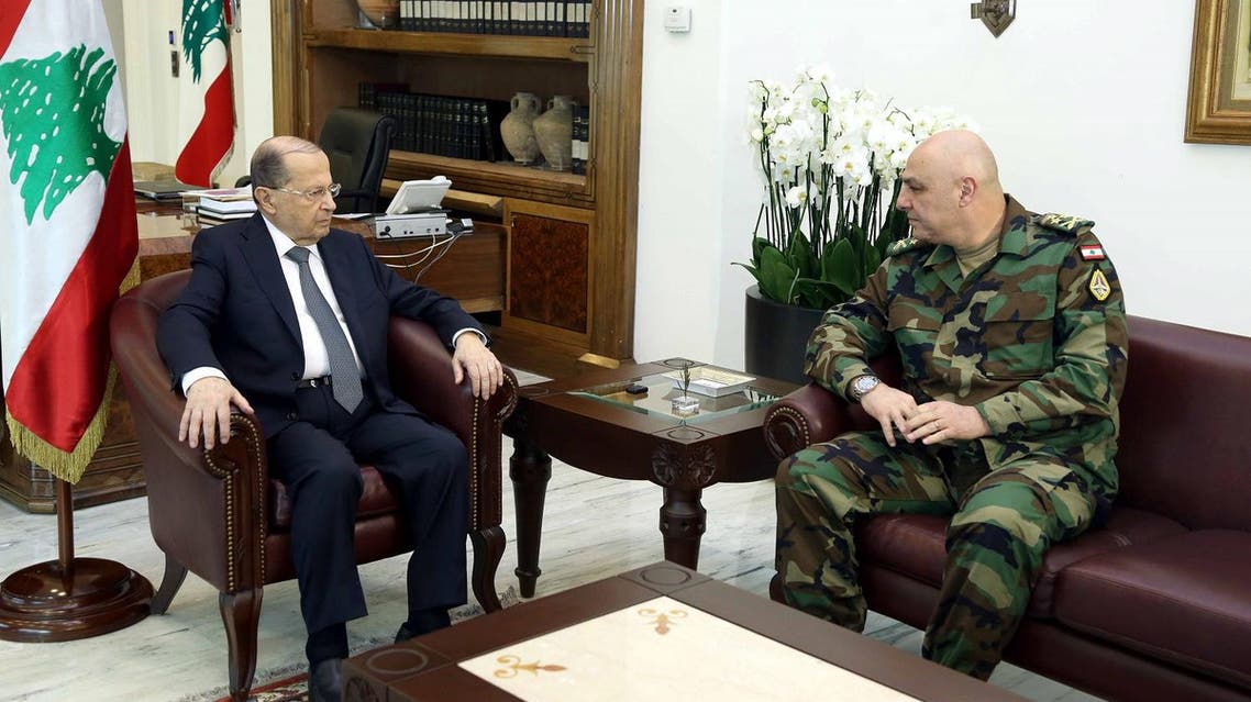 A handout picture provided by the Lebanese photo agency Dalati and Nohra on March 8, 2017 shows President Michel Aoun (L) meeting with the newly appointed army chief, General Joseph Aoun. (AFP)