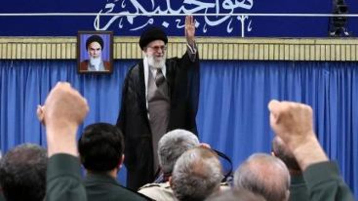 A handout picture released on September 18, 2016 by the official website of the Centre for Preserving and Publishing the Works of Iran's supreme leader Ayatollah Ali Khamenei shows him gesturing to the commanders of Revolutionary Guards during a meeting in Tehran. A portrait of the Islamic republic's late founder, Ayatollah Khomenei (L), is seen on the wall. AFP