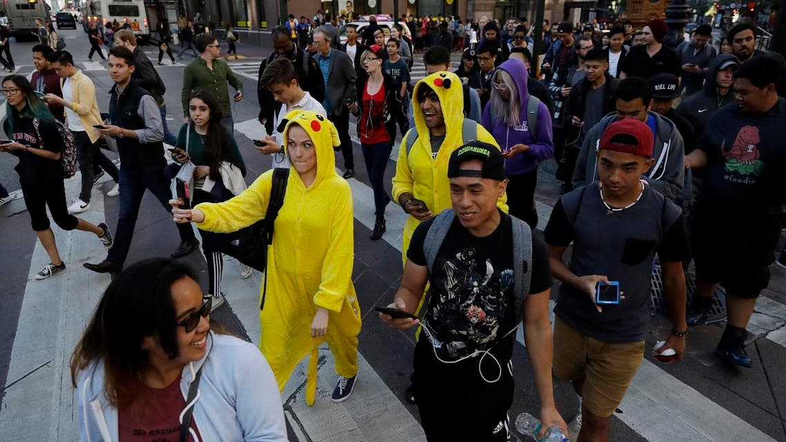 “Pokemon Go” players walk along Market Street, July 20, 2016, in San Francisco. (File Photo: AP)