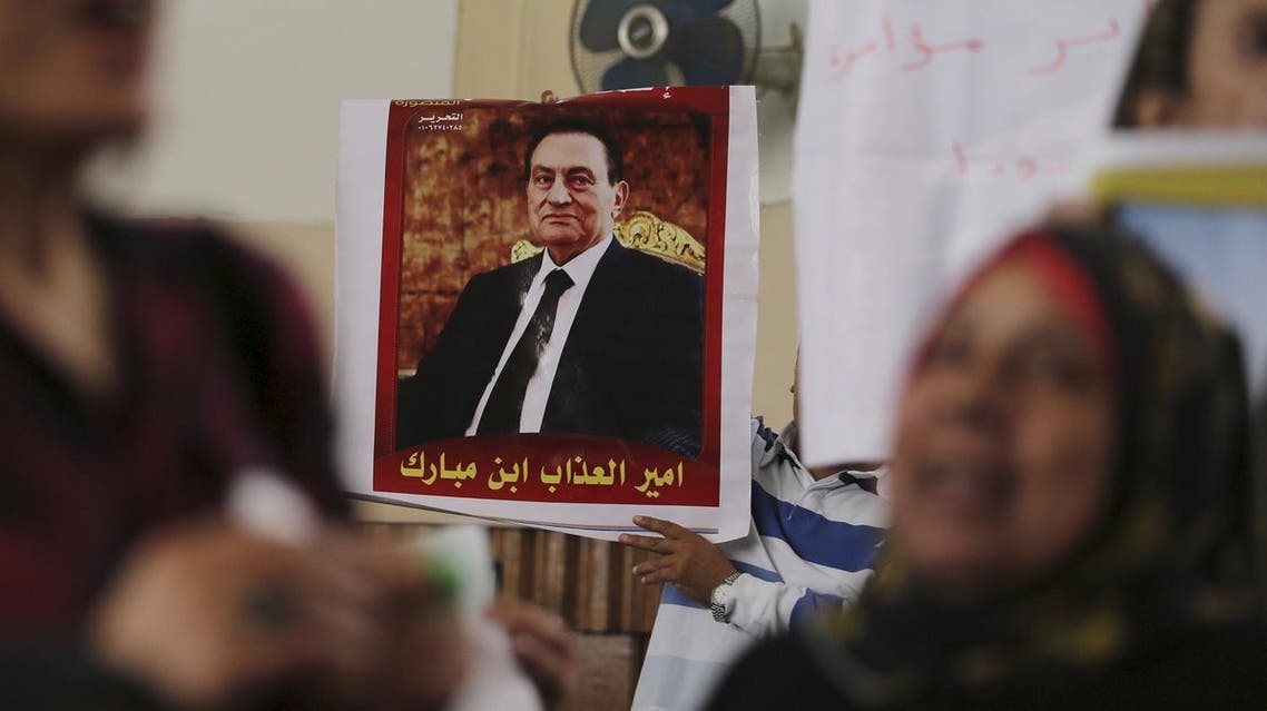 A poster of former Egyptian president Hosni Mubarak that reads, "The sons of Mubarak are princes of misery", is seen at the High Court where Mubarak's trial will take place, in Cairo, Egypt, April 7, 2016. REUTERS