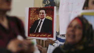 A poster of former Egyptian president Hosni Mubarak that reads, "The sons of Mubarak are princes of misery", is seen at the High Court where Mubarak's trial will take place, in Cairo, Egypt, April 7, 2016. REUTERS