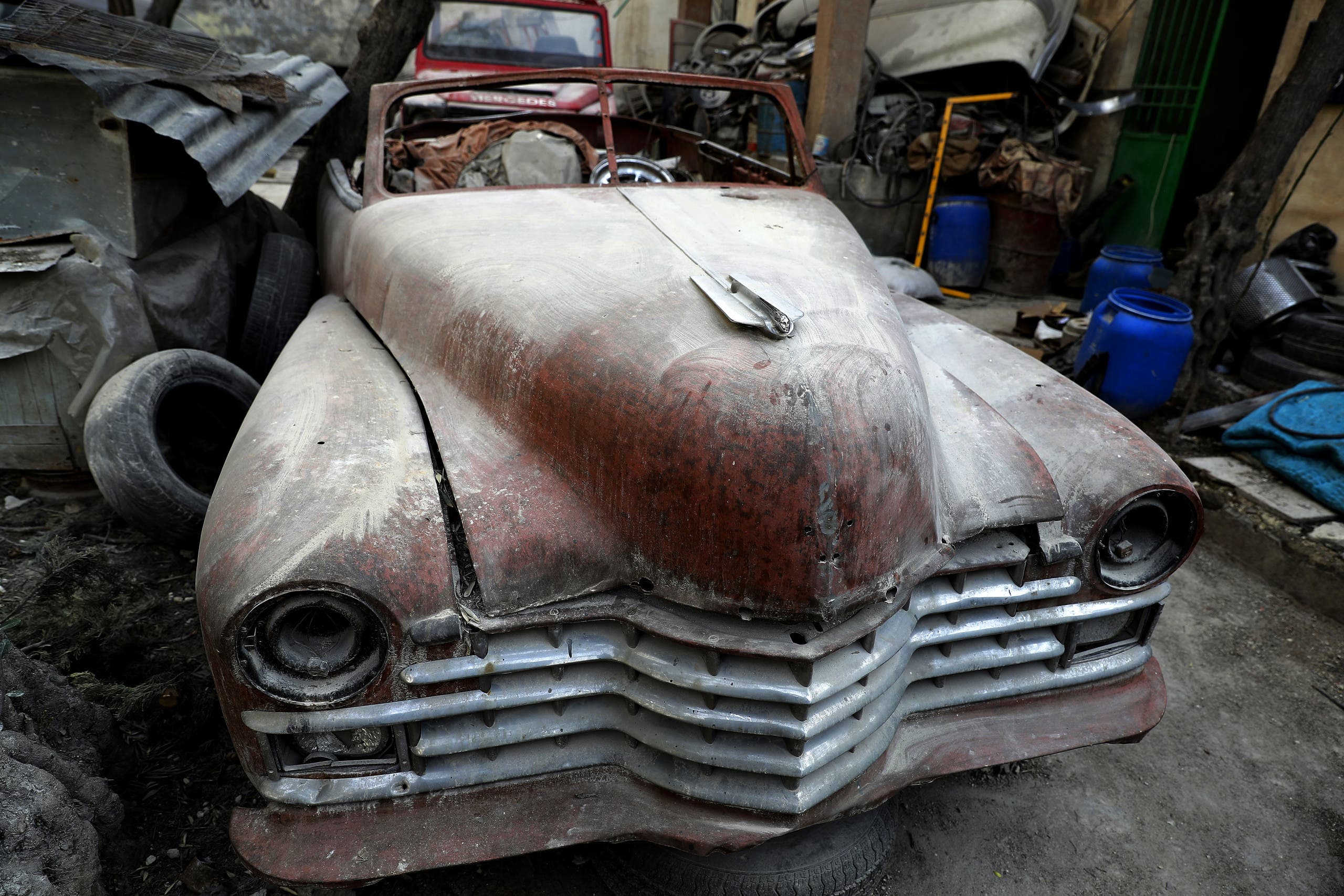 A picture taken on March 9, 2017, shows a 1947 Cadillac parked in the garden of Mohammad Mohiedine Anis' home in Aleppo's formerly rebel-held al-Shaar neighbourhood. AFP