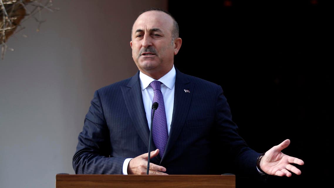 Turkish Foreign Minister Mevlut Cavusoglu holds a press conference with the Turkish Cypriot leader after a meeting on February 21, 2017, in the northern part of Nicosia, in the self proclaimed Turkish Republic of Northern Cyprus (TRNC). AFP