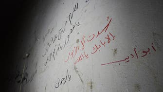 IN PICTURES: The writings on the wall of a former ISIS prison in Syria 