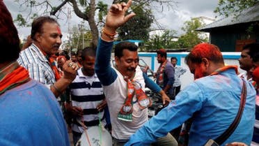 Supporters of India’s Bharatiya Janata Party (BJP) celebrate after learning of the initial poll results outside the party headquarters in Agartala, India, March 11, 2017. (Reuters)