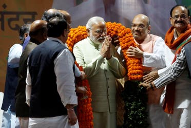 Prime Minister Narendra Modi is being garlanded by party leaders at Bharatiya Janata Party headquarters in New Delhi, on March 12, 2017. (Reuters)