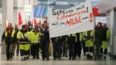 Members of Germany’s Verdi union take part in a warning strike by ground services, security inspection and check-in staff at Tegel airport in Berlin, on March 10, 2017. (Reuters)