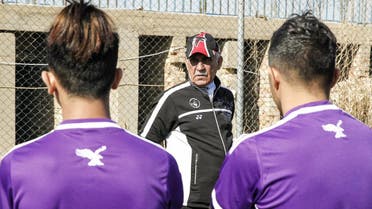 Kadhim Flayeh, a mute Iraqi football coach, uses sign language and hand gestures to train players at a football pitch in Baghdad, on January 30, 2017. (AFP)