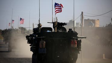 A convoy of US forces armoured vehicles drives near the village of Yalanli, on the western outskirts of the northern Syrian city of Manbij, on March 5, 2017. 