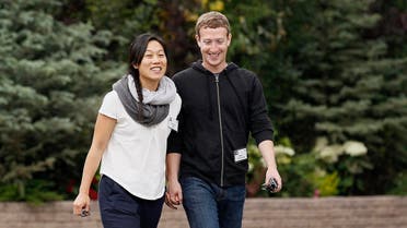 Facebook CEO Mark Zuckerberg walks with his wife Priscilla Chan at the annual Allen and Co. conference at the Sun Valley, Idaho Resort July 11, 2013. (Reuters)
