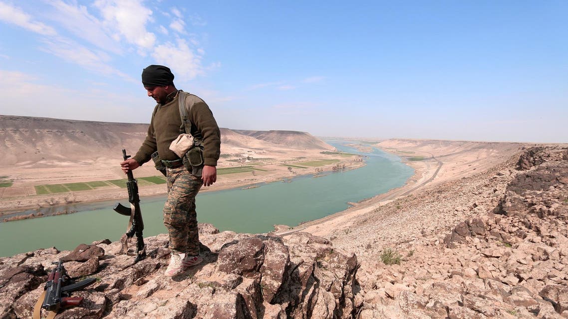 A Syrian Democratic Forces(SDF) fighter poses for a picture near Euphrates River, north of Raqqa city, Syria March 8, 2017. (Reuters)