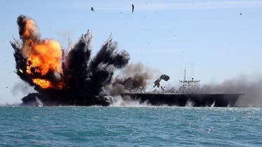 Iran's elite Revolutionary Guard troops attacks a naval vessel during a military drill in the Strait of Hormuz in southern Iran on February 25, 2015. (AP)