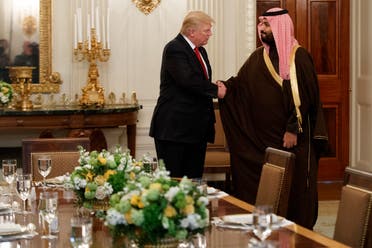  President Donald Trump shakes hands with Saudi Defense Minister and Deputy Crown Prince Mohammed bin Salman, Tuesday, March 14, 2017, in the State Dining Room of the White House in Washington. (AP Photo/Evan Vucci)