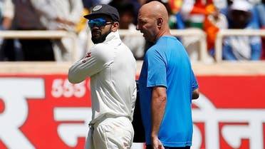 India’s captain Virat Kohli (left) walks off the field after injuring himself. (Reuters)