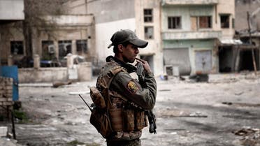 A member of the Iraqi forces holds a position in a western neighbourhood of Mosul on March 13, 2017, during an offensive to retake the city from Islamic State (IS) group fighters.  ARIS MESSINIS / AFP